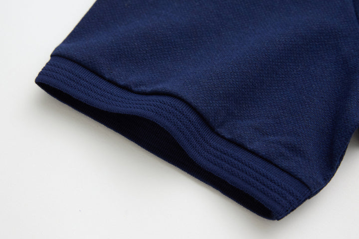 Dress blue polo shirt sleeve cuff and folded hem with neat edge stitching