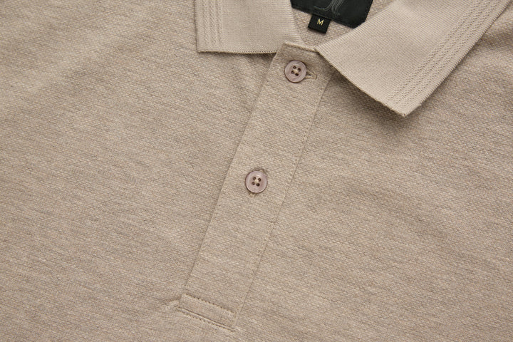 Beige polo shirt chest with three-button placket and textured fabric detail