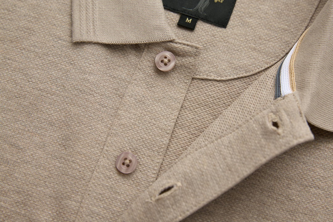 Beige polo shirt collar with button closure and side seam detail