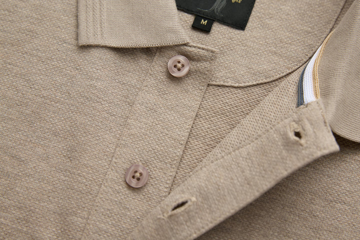 Beige polo shirt collar with button closure and side seam detail