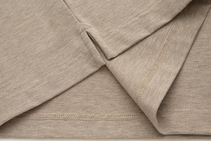 Beige polo shirt neckline and placket seam detail