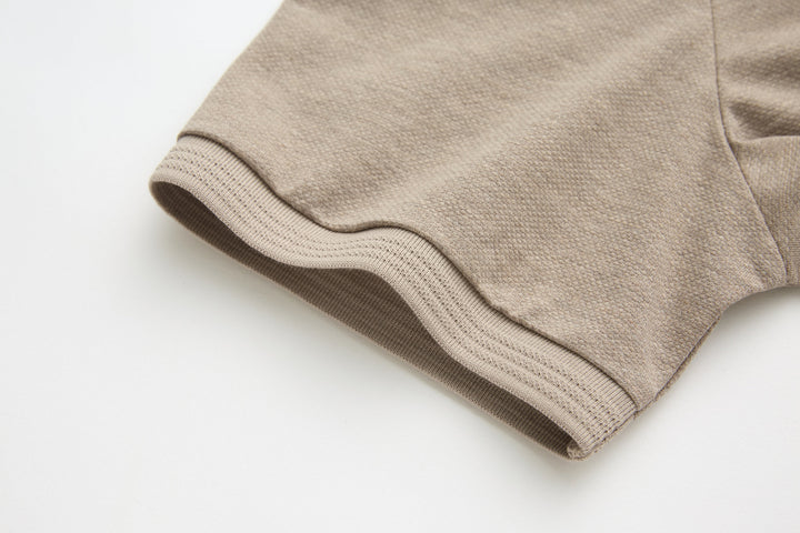 Beige polo shirt sleeve cuff with knit edge and reinforced hem