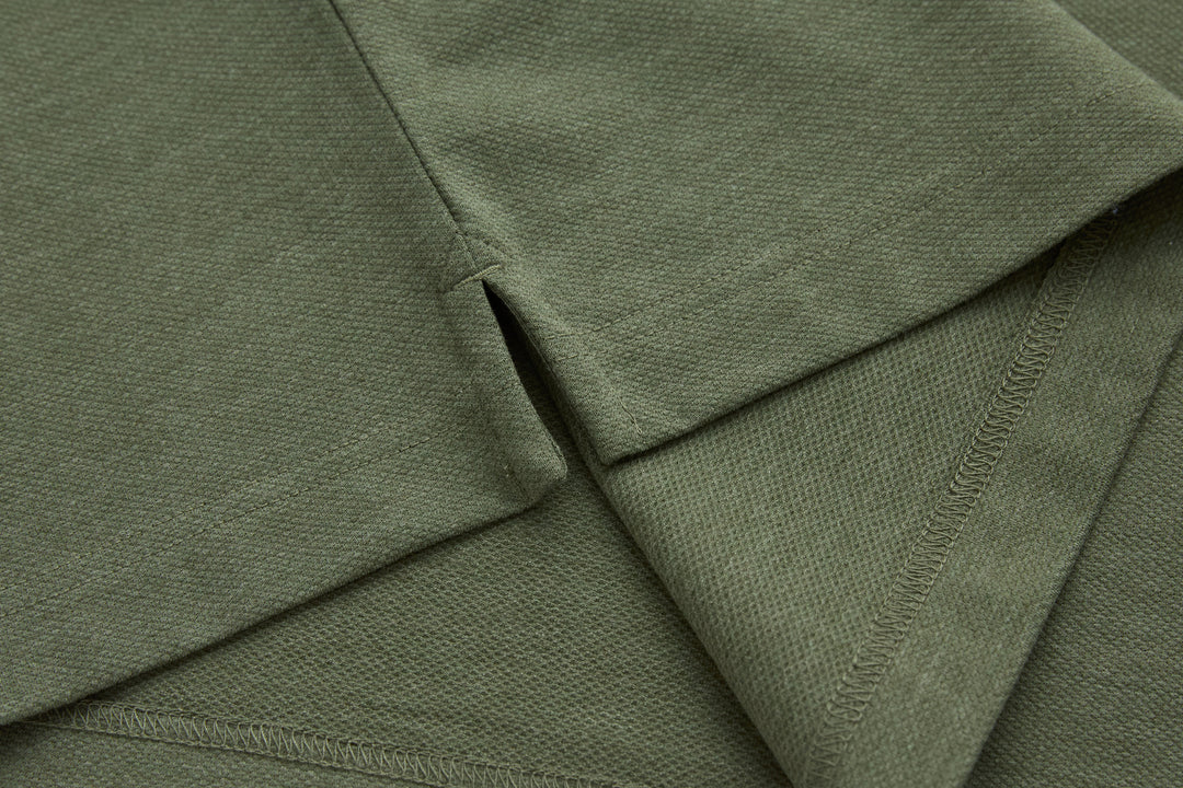 Olive polo shirt seam and side hem with knit stitching detail