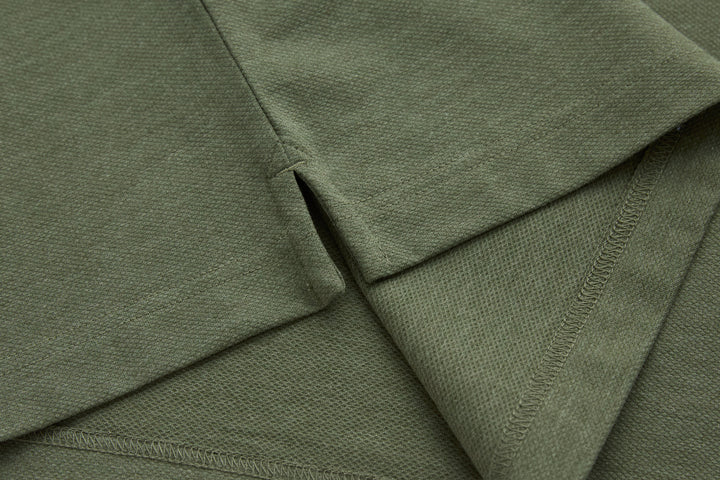 Olive polo shirt seam and side hem with knit stitching detail
