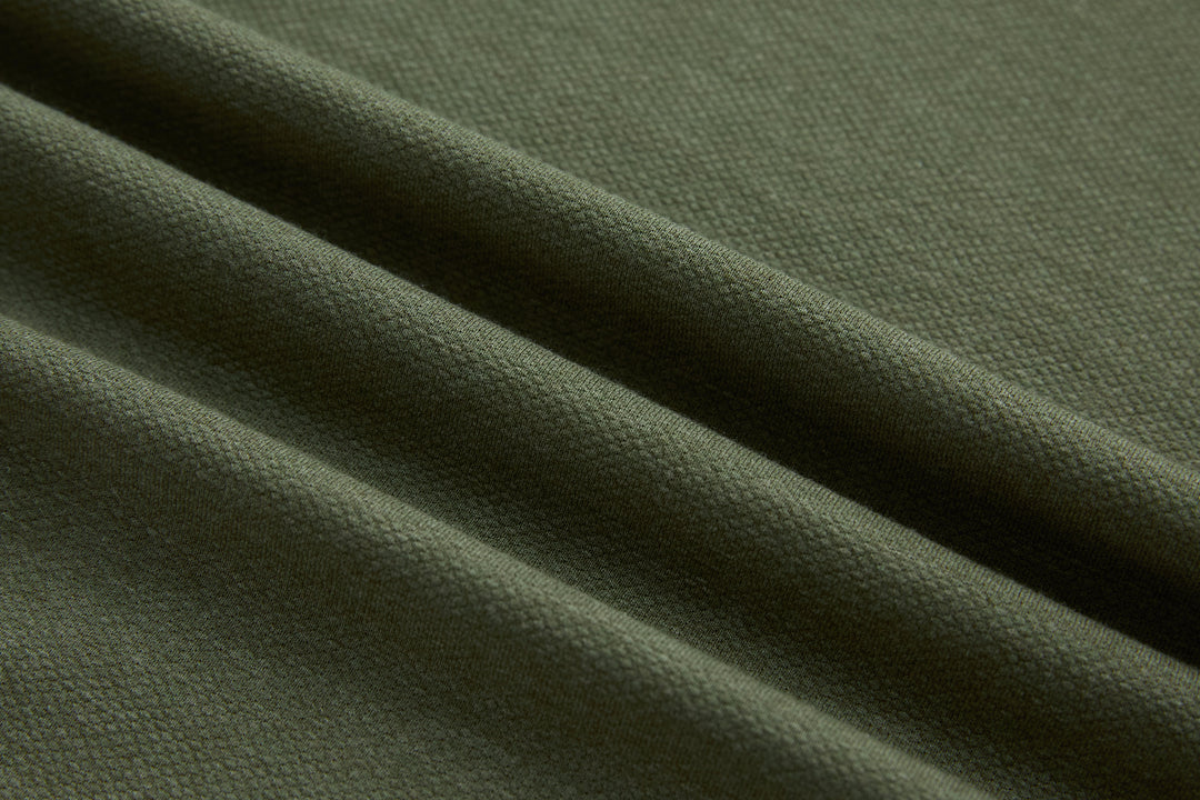 Olive polo shirt knit fabric, close-up texture detail