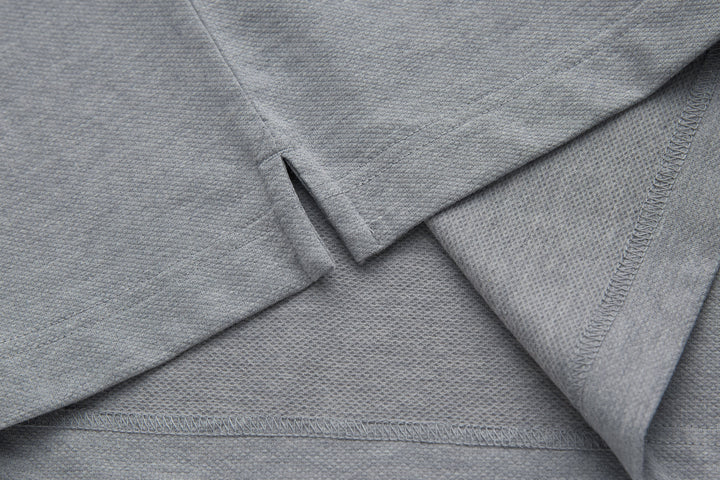 Light gray polo shirt shoulders with seam detail and collar edge
