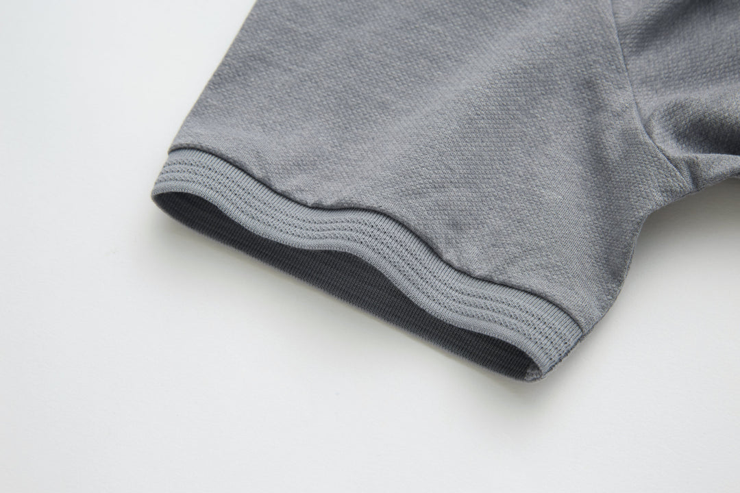 Light gray polo shirt ribbed hem with dark inner trim
