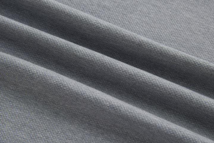 Light gray polo shirt knit fabric close-up texture detail
