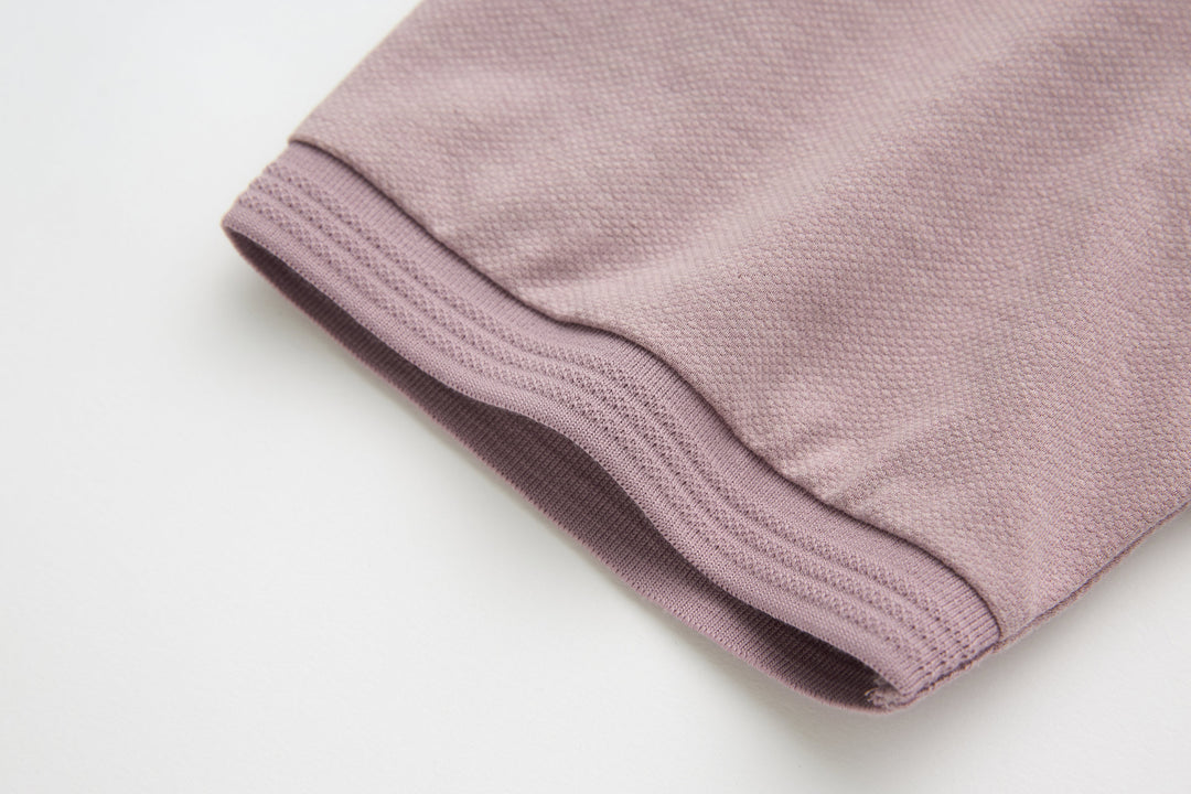 Woodrose polo shirt hem and sleeve cuff folded, solid knit finish