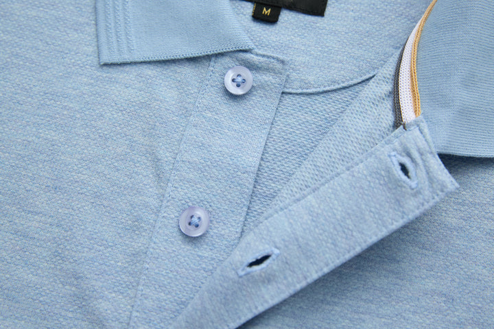Sky blue polo shirt with button placket and short side vent detail