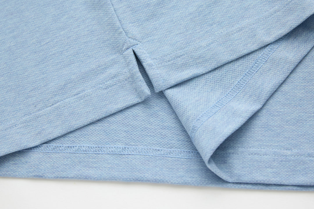 Sky blue polo shirt with side vent seam and smooth placket
