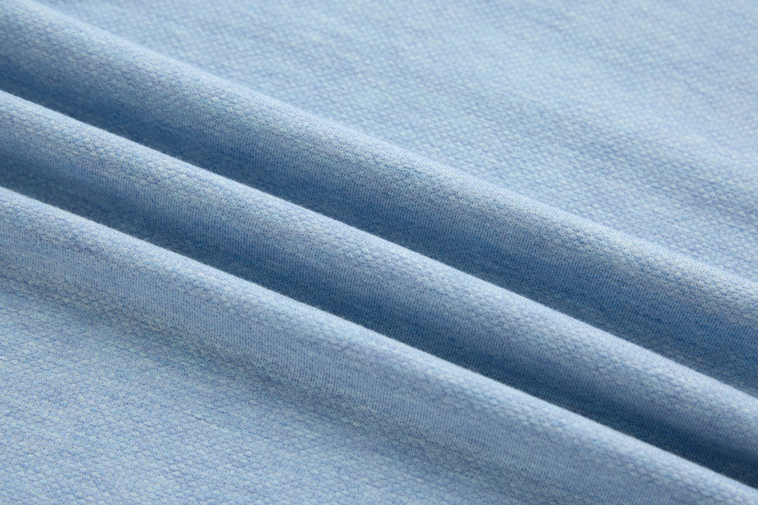 Sky blue polo shirt fabric texture close-up