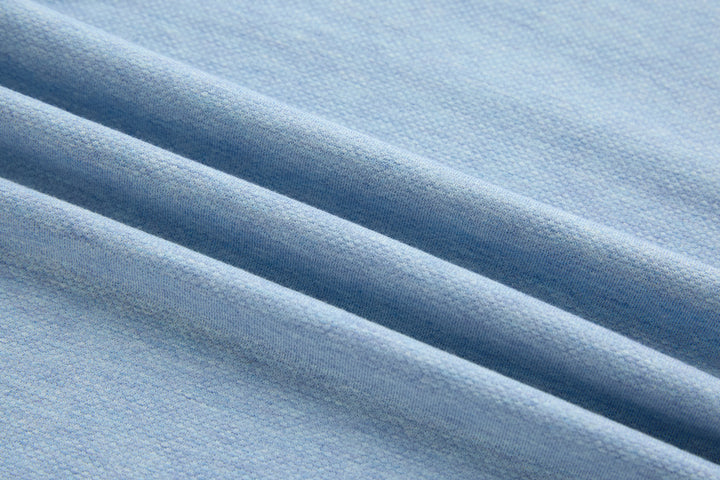 Sky blue polo shirt fabric texture close-up