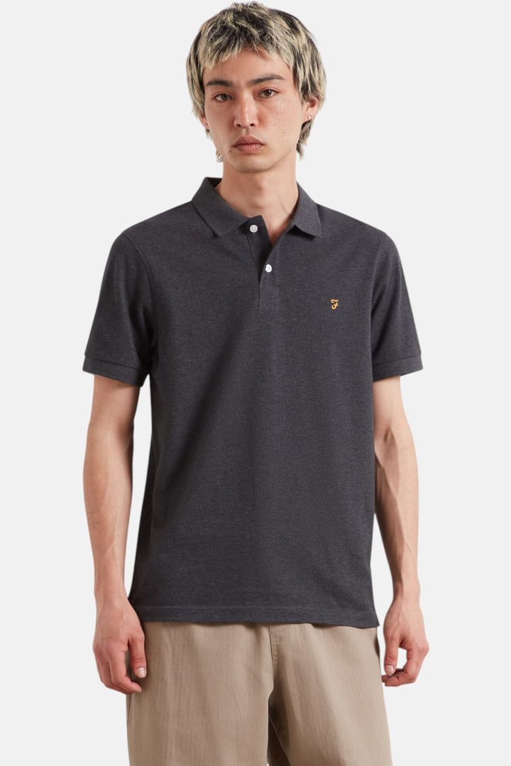Washed black marl polo shirt with short sleeves, button placket, and small chest logo