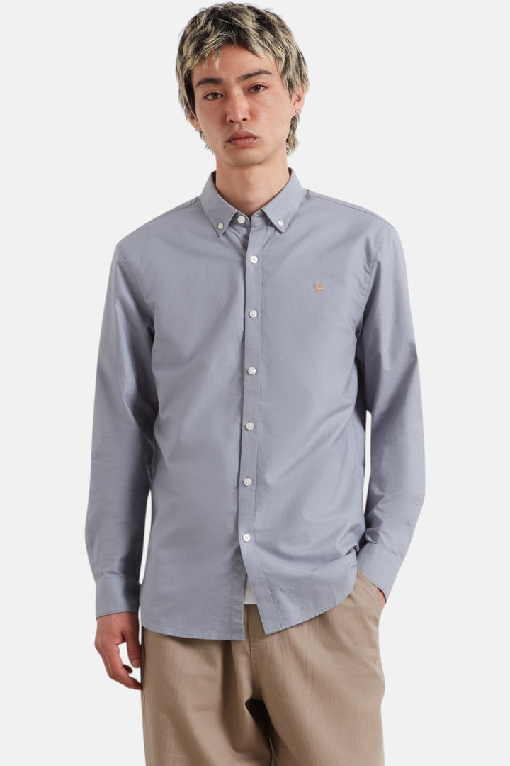 Slim-fit light blue Oxford button-down shirt with long sleeves and button front