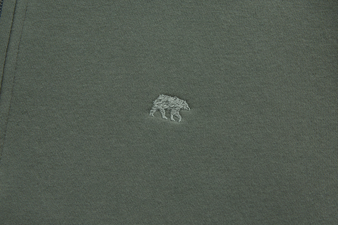 Olive 1/4-zip top with small chest animal logo embroidery
