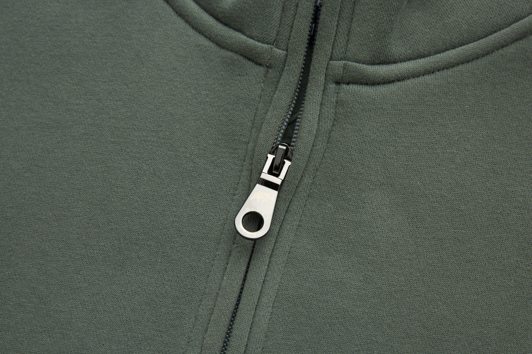 Olive 1/4-zip top zipper with metal pull and white zipper tab
