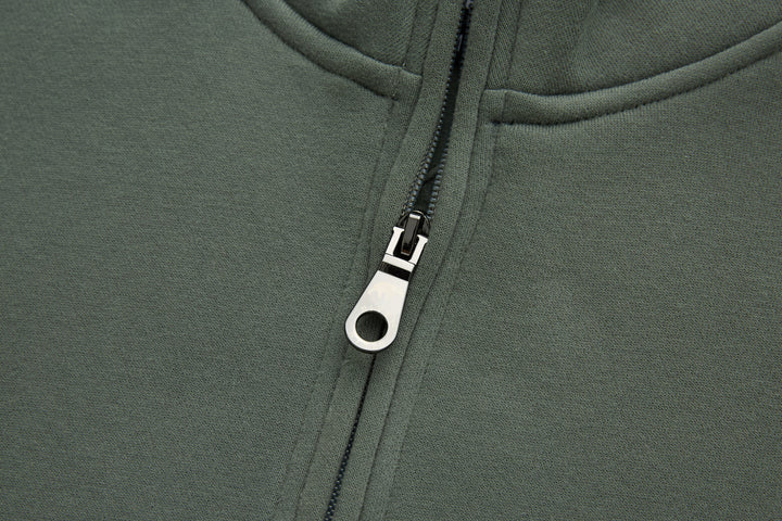 Olive 1/4-zip top zipper with metal pull and white zipper tab