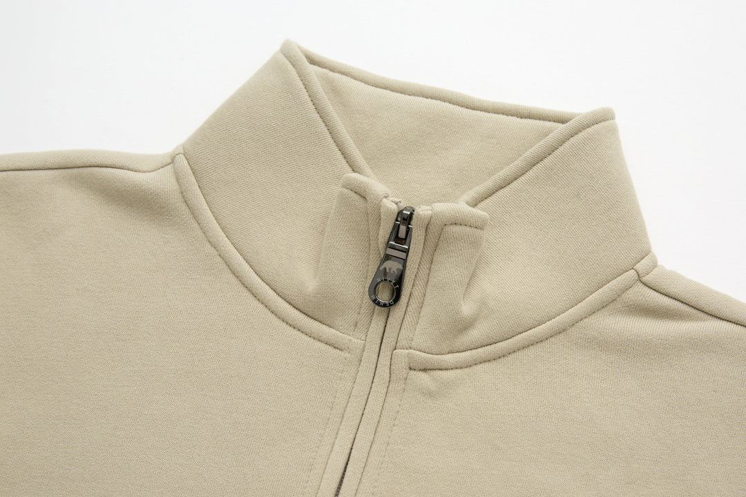 Beige 1/4-zip top with stand collar and zip placket