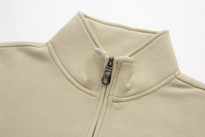 Beige 1/4-zip top with stand collar and zip placket