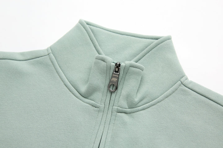 Jade 1/4-zip top neckline and zipper placket close-up