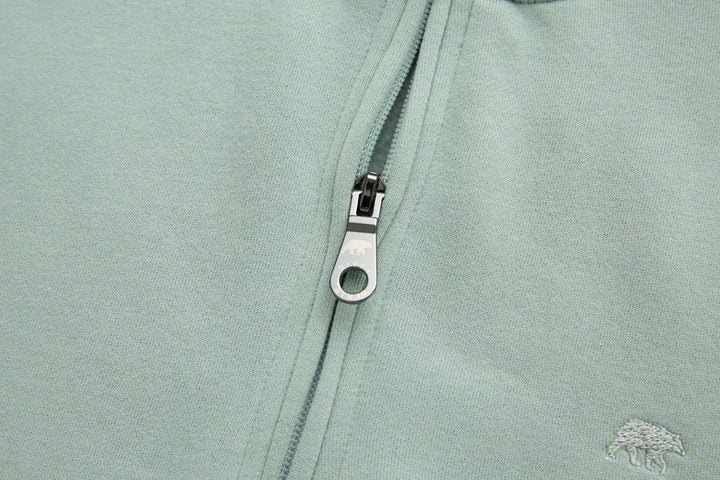 Jade 1/4-zip top zipper pull and metal ring close-up