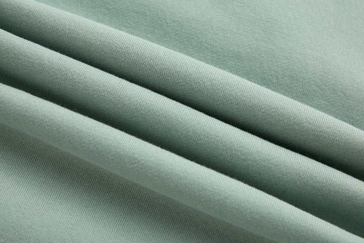 Jade 1/4-zip top fabric close-up with smooth knit texture