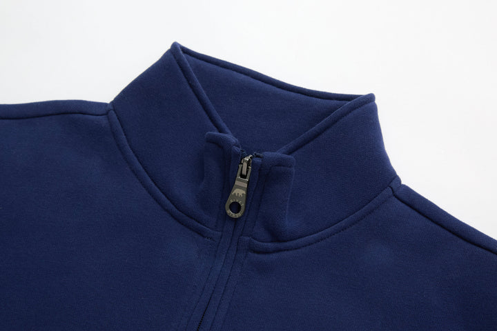 Dark blue 1/4-zip top neckline with zip pull and standing collar