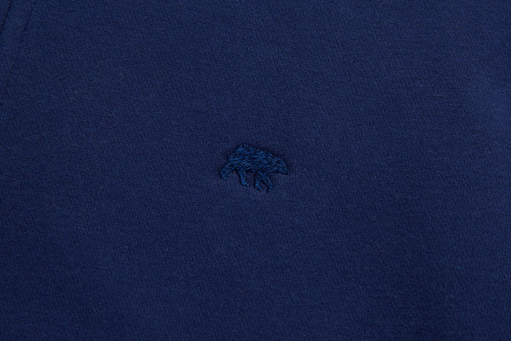 Dark blue top with small embroidered chest logo