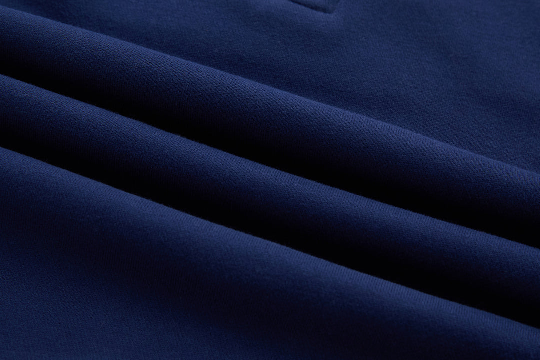 Dark blue knit fabric close-up with smooth textured surface