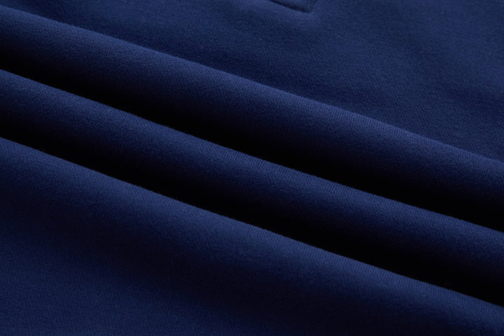 Dark blue knit fabric close-up with smooth textured surface
