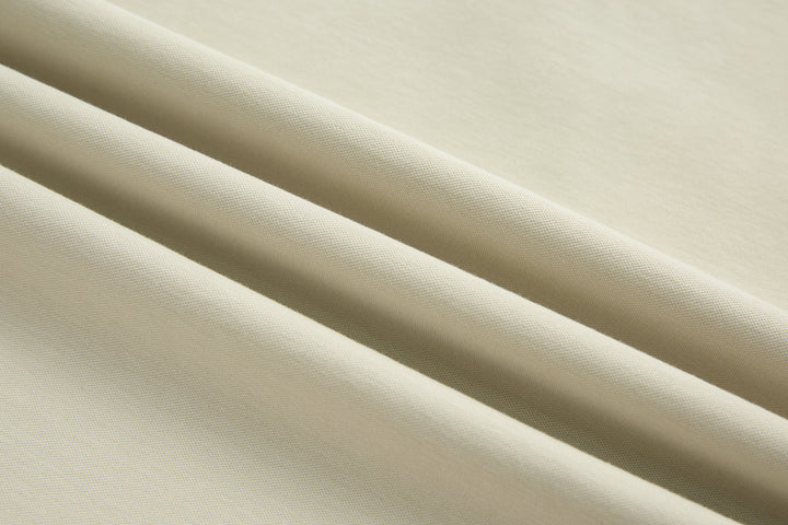 Bone-colored denim top fabric texture, close-up view