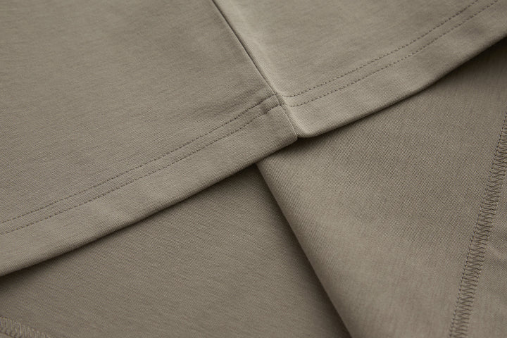 Cinder grandad top hem and side seam with visible stitching