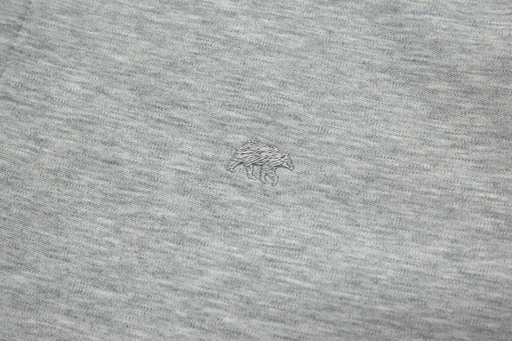 Heather gray top fabric with small chest logo mark