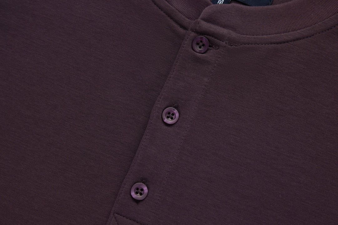 Raisin grandad-style top with three-button front placket in dark purple knit