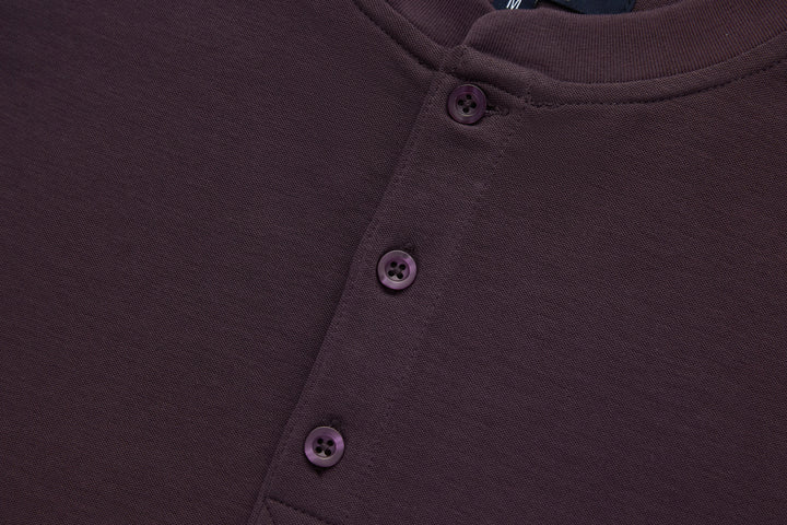 Raisin grandad-style top with three-button front placket in dark purple knit