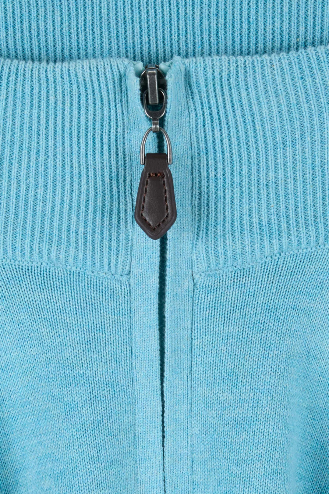 Aqua knit 1/4-zip detail with metal zipper pull and dark leather tab