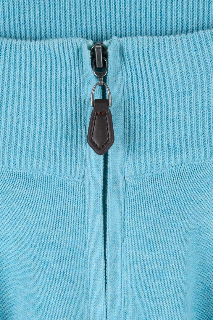 Aqua knit 1/4-zip detail with metal zipper pull and dark leather tab