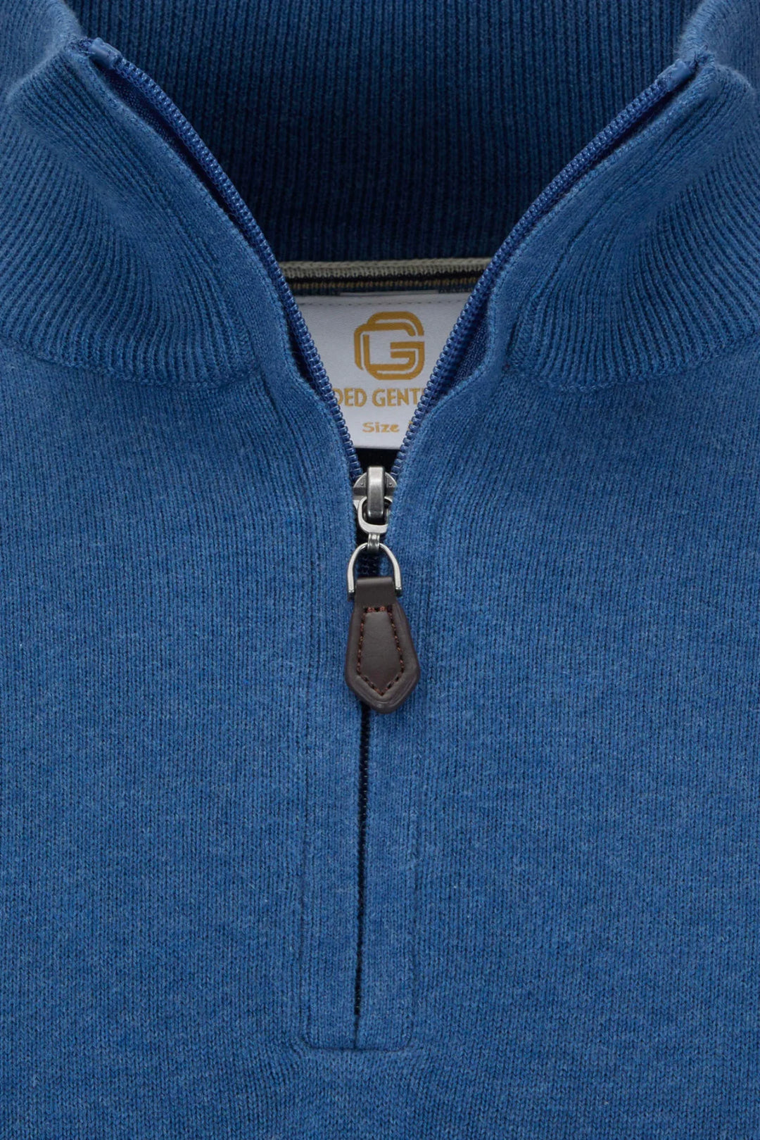 Blue knit 1/4-zip jumper with metal zipper and leather pull tab detail.