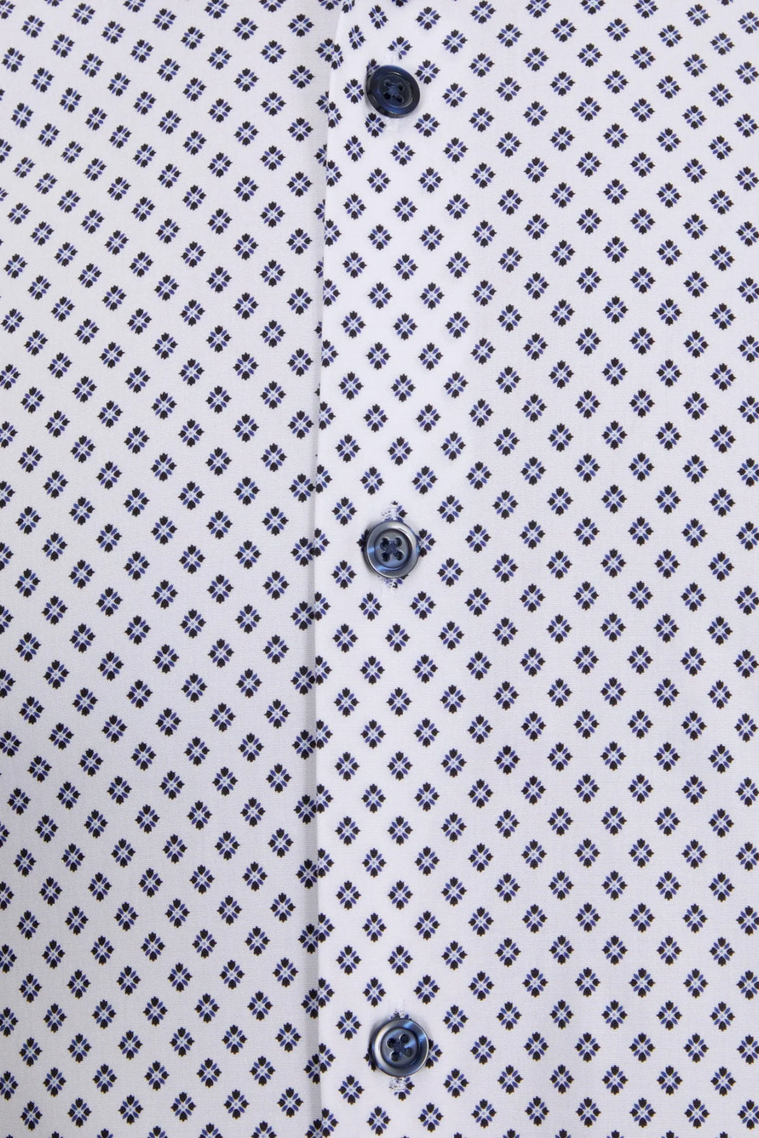Men's dress shirt front closeup, navy patterned fabric and dark button placket.