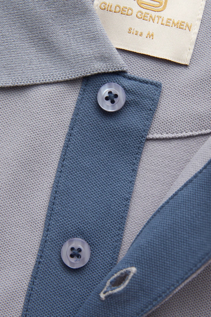 Grey polo shirt with blue inner placket and two-button collar