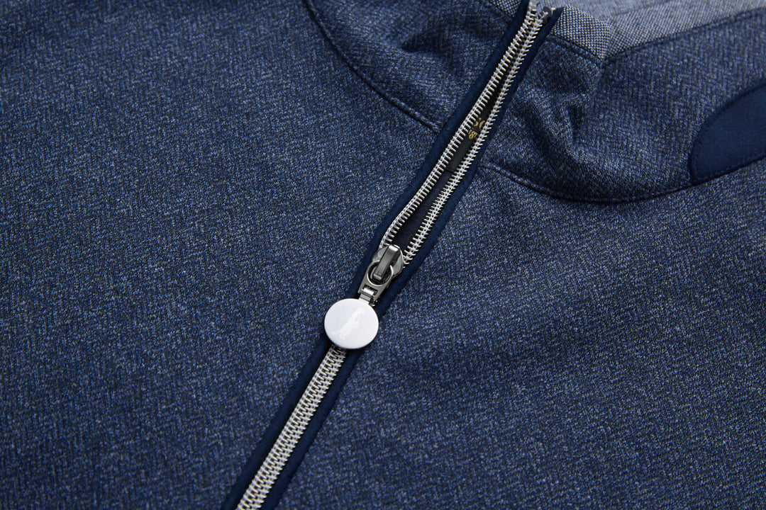 Dark blue herringbone 1/4-zip top zipper with white pull tab
