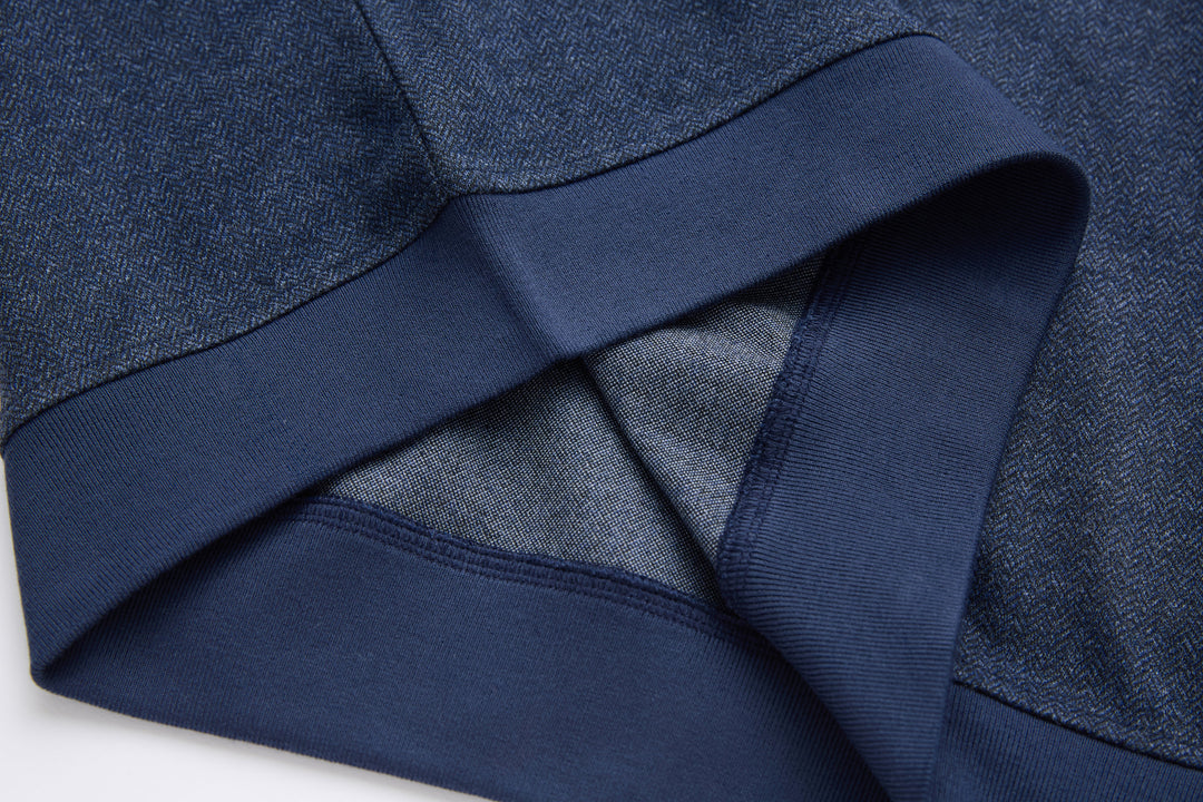 Dark blue herringbone 1/4-zip top neckline with inner placket detail