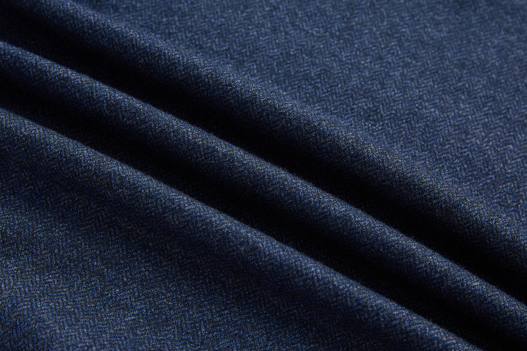 Dark blue herringbone knit fabric texture, close-up