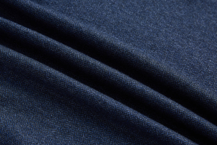 Dark blue herringbone knit fabric texture, close-up