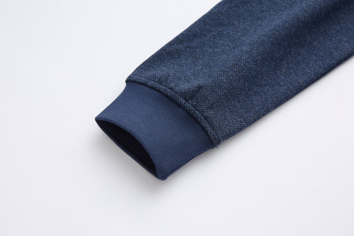 Dark blue herringbone 1/4-zip top sleeve cuff, folded hem