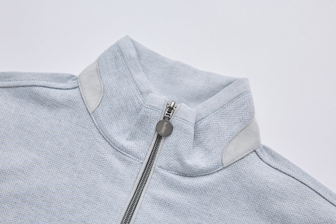 Grey herringbone 1/4-zip top collar and quarter zip pull