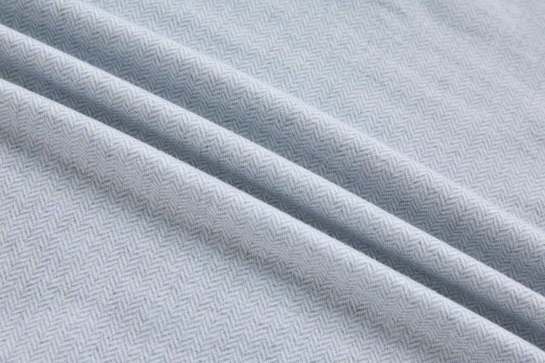 Grey herringbone 1/4-zip top fabric texture close-up, diagonal weave