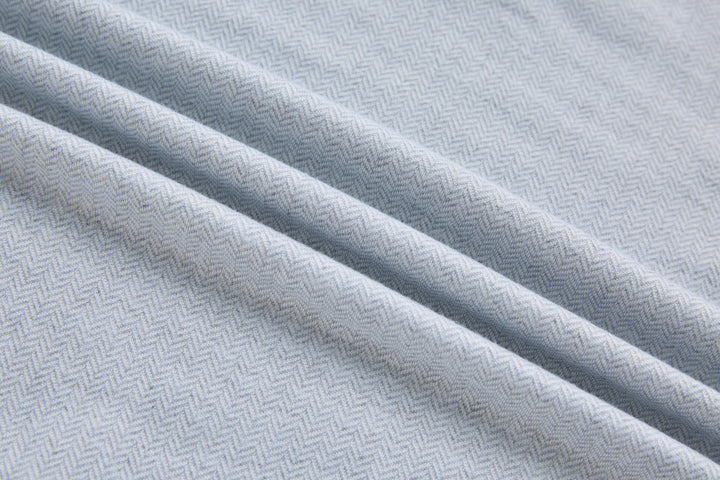 Grey herringbone 1/4-zip top fabric texture close-up, diagonal weave