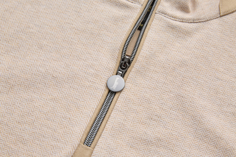 Quarter zipper pull on herringbone top with round logo button